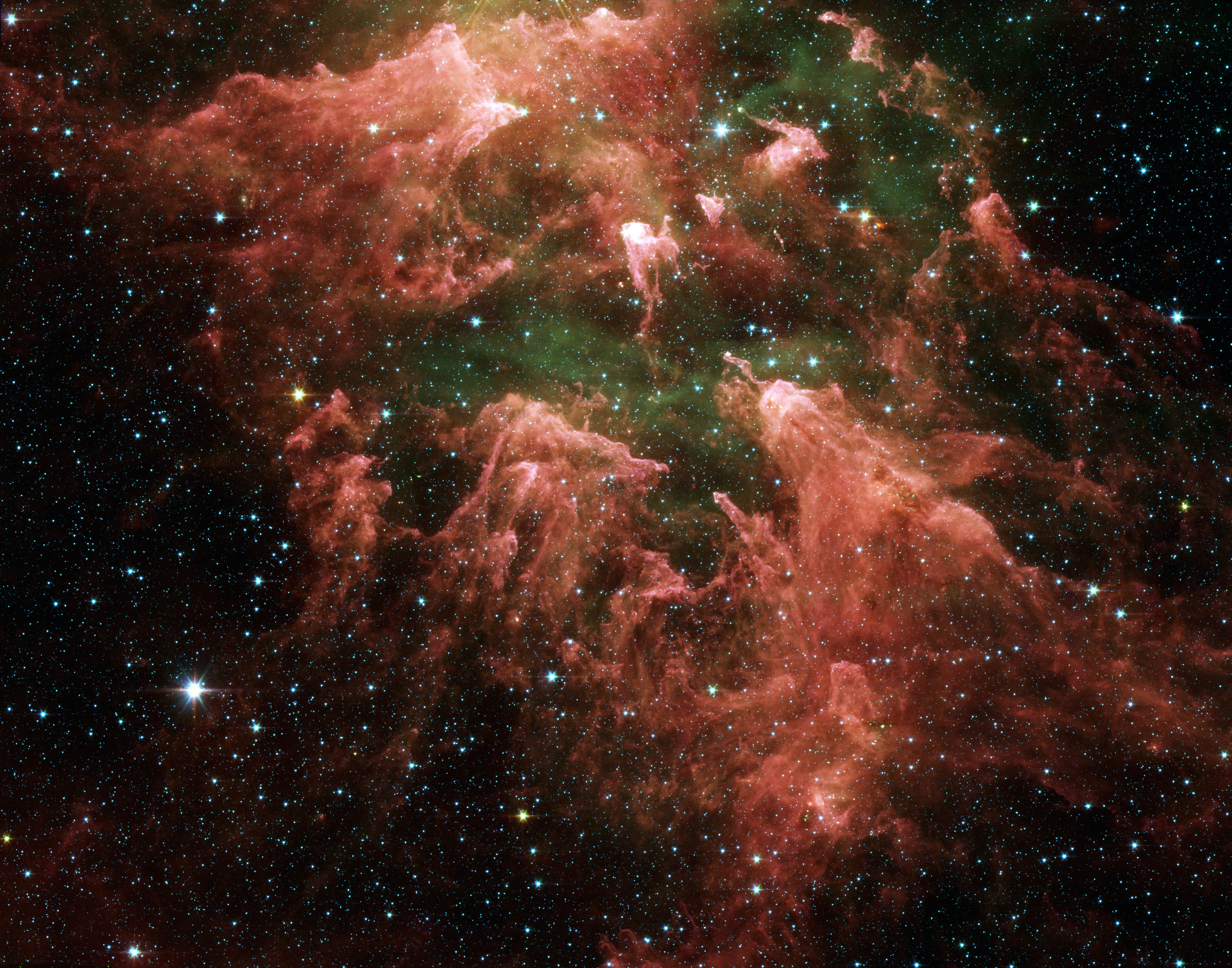 Spitzer révèle des étoiles embryonnaires vivant dans le voisinage détruit de l'une des étoiles massives les plus célèbres de la Voie lactée, Eta Carinae. ©NASA/JPL-Caltech/N. Smith