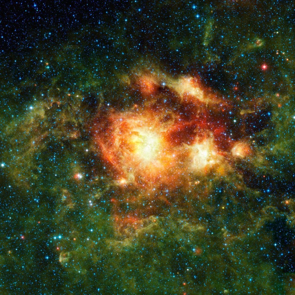 Un nuage de formation d'étoiles grouillant de gaz, de poussières et d'étoiles naissantes massives. ©NASA/JPL-Caltech/UCLA